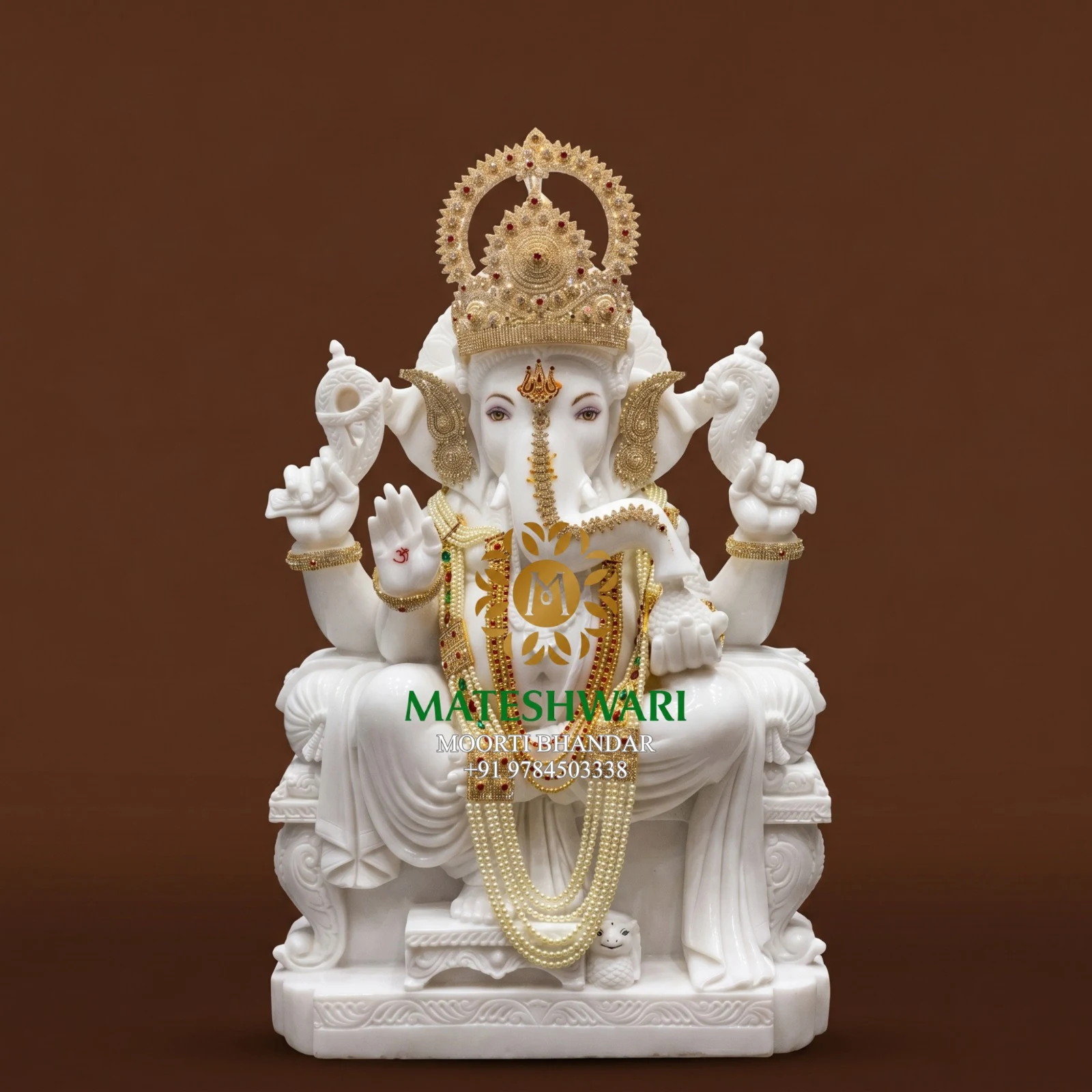 Handcrafted white marble idol with gold jewelry